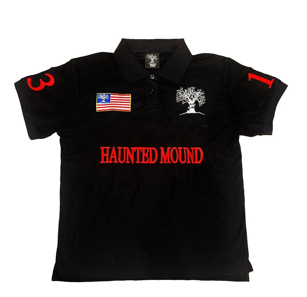 ‘H4UNTED MOUND’ tee in black. Red gothic lettering. Flag patch. Numbered sleeves.