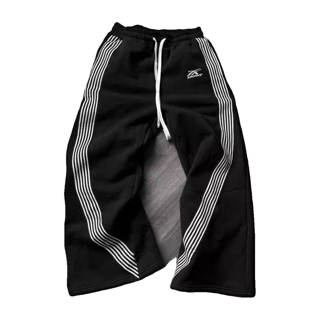 ‘ARCH!VE’ sweatpants – black sweatpants, white triple stripes down the legs, drawstring waist